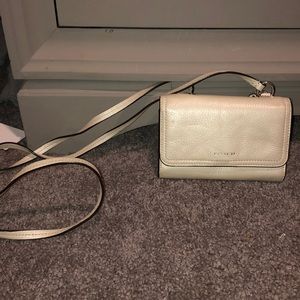 Small neutral colored coach purse